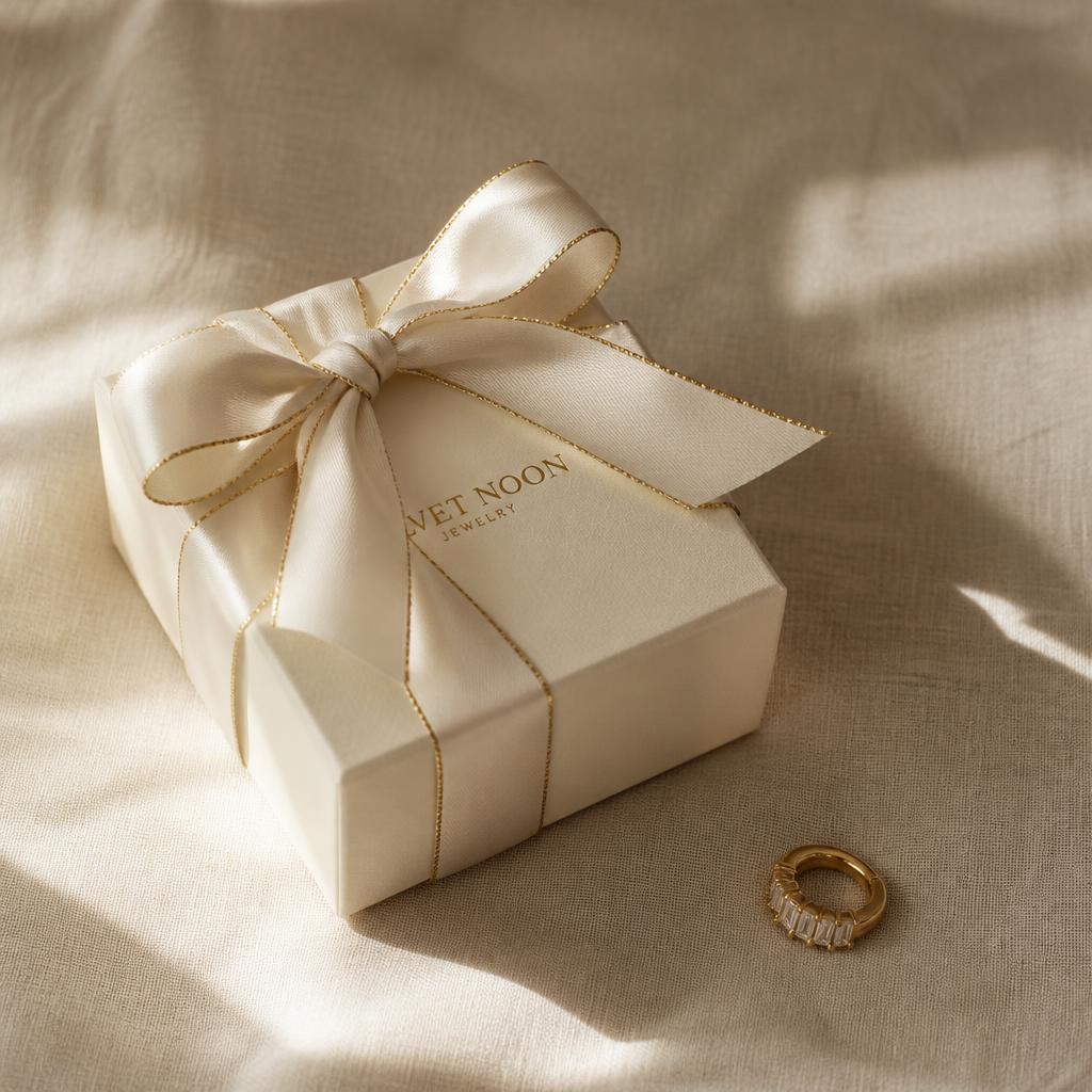 Ivory gift box with gold ribbon